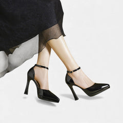 Red leather Evette heels by THE WHITMORE FAMILY displayed on a neutral background, showcasing the elegant design and pointed toe.