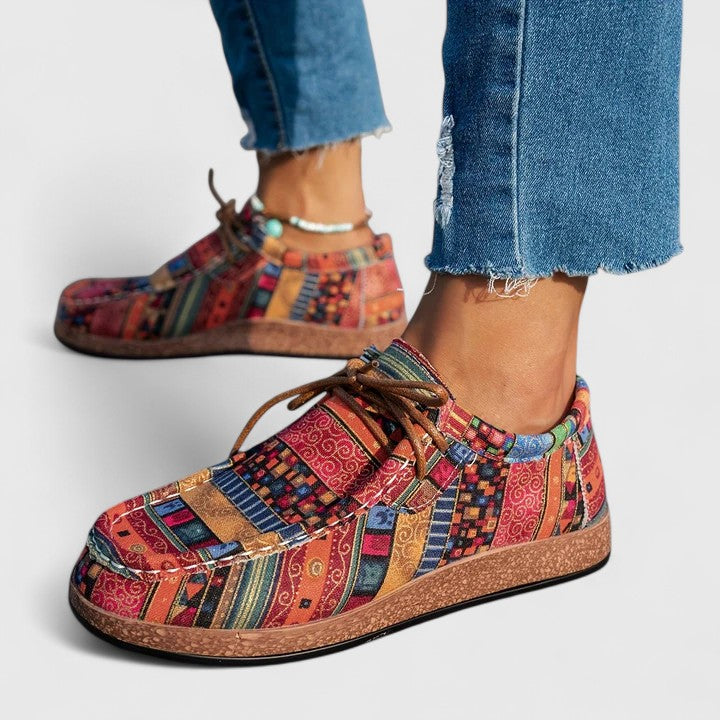 Red Nychelle orthopedic shoes by THE WHITMORE FAMILY, featuring supportive design and comfortable fit.