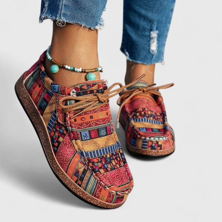 Red Nychelle orthopedic shoes by THE WHITMORE FAMILY featuring supportive design and comfortable soles.