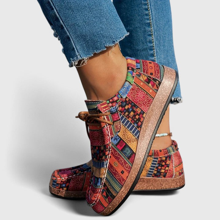 Red Nychelle orthopedic shoes by THE WHITMORE FAMILY, featuring supportive design and comfortable fit for everyday wear.