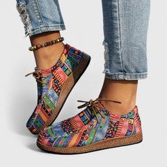 Red Nychelle orthopedic shoes by THE WHITMORE FAMILY featuring cushioned soles and supportive design for comfort.