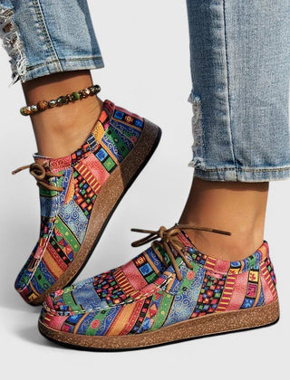 Red Nychelle orthopedic shoes by THE WHITMORE FAMILY featuring cushioned soles and supportive design for comfort.