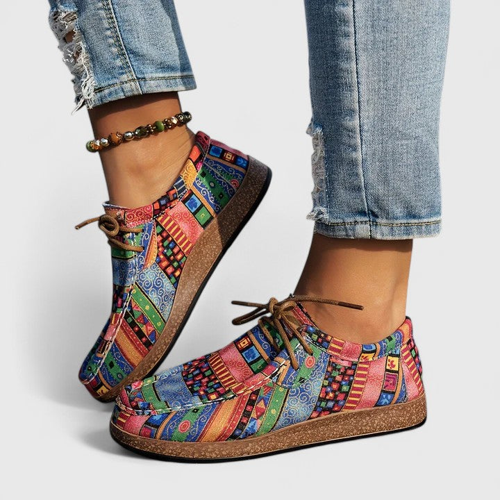 Red Nychelle orthopedic shoes by THE WHITMORE FAMILY featuring cushioned soles and supportive design for comfort.