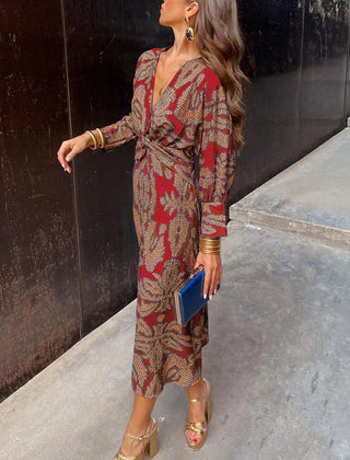 Elegant floral print Dineke dress by THE WHITMORE FAMILY, showcasing a stylish and sophisticated dress design.