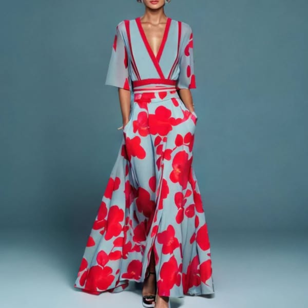 Hazel floral maxi dress by THE WHITMORE FAMILY featuring a belted waist and V-neck design, vibrant red and floral pattern.