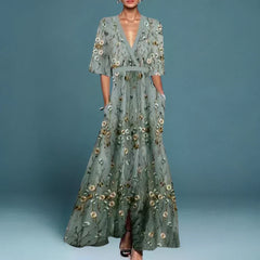 Hazel belted V-neck floral maxi dress by THE WHITMORE FAMILY, featuring a flowing silhouette and vibrant flower print.