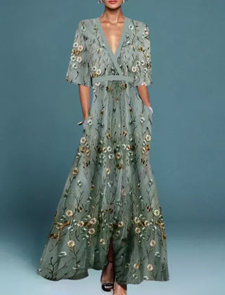 Hazel belted V-neck floral maxi dress by THE WHITMORE FAMILY, featuring a flowing silhouette and vibrant flower print.