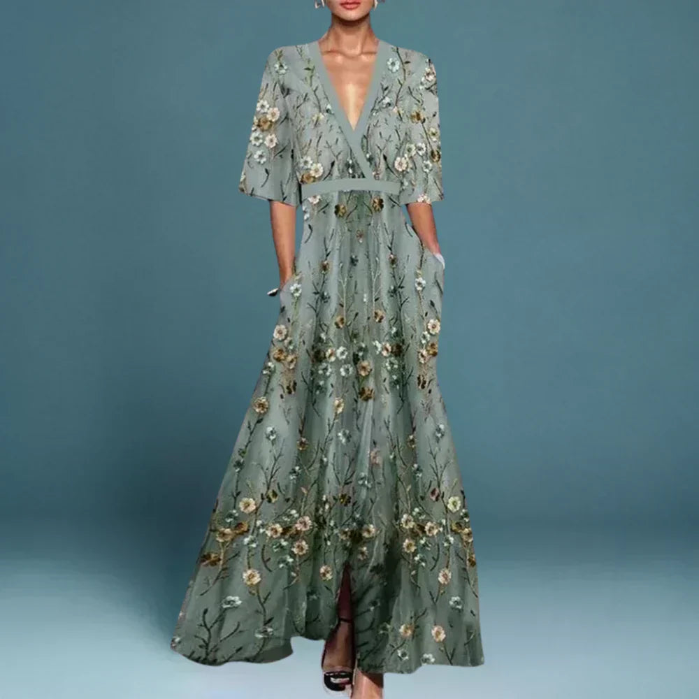 Hazel belted V-neck floral maxi dress by THE WHITMORE FAMILY, featuring a flowing silhouette and vibrant flower print.