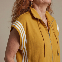 Red THE WHITMORE FAMILY Lark zip front stripe panel jumpsuit displayed on a hanger with a fitted silhouette and bold stripe details.