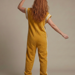 Red Lark zip-front stripe panel jumpsuit by THE WHITMORE FAMILY, featuring a stylish design and comfortable fit.