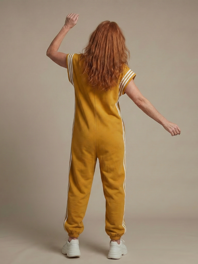 Red Lark zip-front stripe panel jumpsuit by THE WHITMORE FAMILY, featuring a stylish design and comfortable fit.