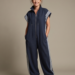 Red Lark zip-front stripe panel jumpsuit by THE WHITMORE FAMILY, featuring a stylish front zipper and bold stripe design.