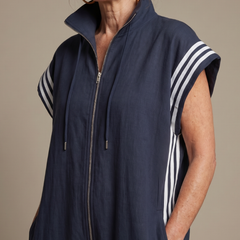 Red Zip Front Stripe Panel Jumpsuit by THE WHITMORE FAMILY, featuring a fitted silhouette and stylish stripe details.
