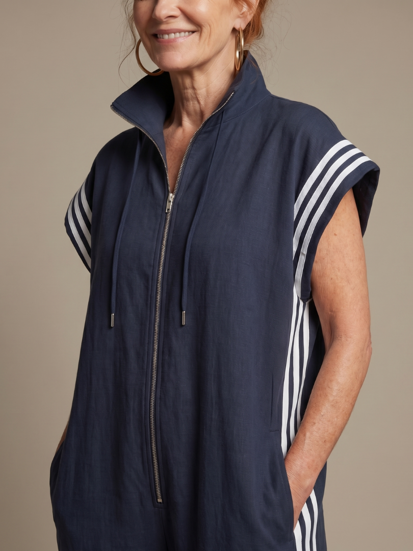 Red Zip Front Stripe Panel Jumpsuit by THE WHITMORE FAMILY, featuring a fitted silhouette and stylish stripe details.