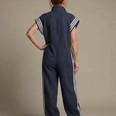 Red Lark Zip Front Stripe Panel Jumpsuit by THE WHITMORE FAMILY, featuring a front zipper and bold stripe design.