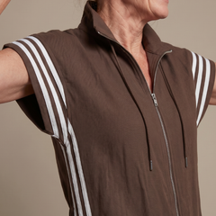 Red Lark zip-front stripe panel jumpsuit by THE WHITMORE FAMILY, featuring a fitted silhouette and bold stripe design.