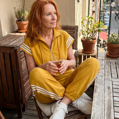 Red Lark Zip Front Stripe Panel Jumpsuit by THE WHITMORE FAMILY, featuring a front zipper and stylish stripe panels.