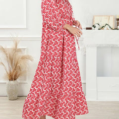 Nina floral boho maxi dress by THE WHITMORE FAMILY featuring vibrant red floral pattern and flowing silhouette.