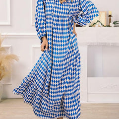 Nina floral boho maxi dress in red by THE WHITMORE FAMILY, flowing fabric with a bohemian floral pattern and relaxed fit.