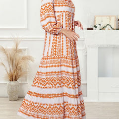 Nina floral boho maxi dress by THE WHITMORE FAMILY, featuring vibrant floral patterns and flowing fabric, shown on a model.