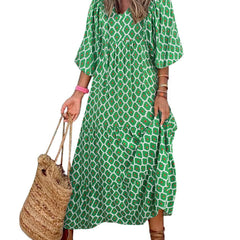 Nina floral boho maxi dress by THE WHITMORE FAMILY featuring a vibrant red floral pattern and flowing silhouette.