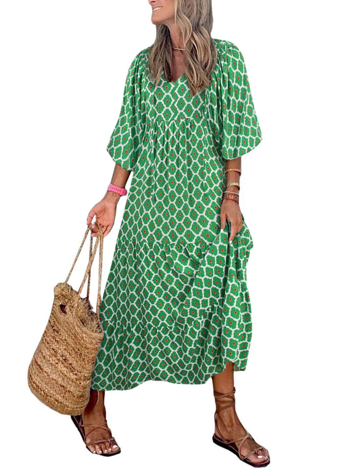 Nina floral boho maxi dress by THE WHITMORE FAMILY featuring a vibrant red floral pattern and flowing silhouette.