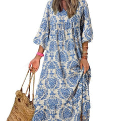 Nina floral boho maxi dress by THE WHITMORE FAMILY, featuring a vibrant floral pattern, flowing fabric, and bohemian style.