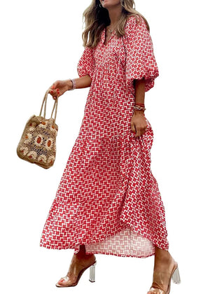 Nina floral boho maxi dress by THE WHITMORE FAMILY, featuring a flowing design with vibrant floral print and bohemian style.