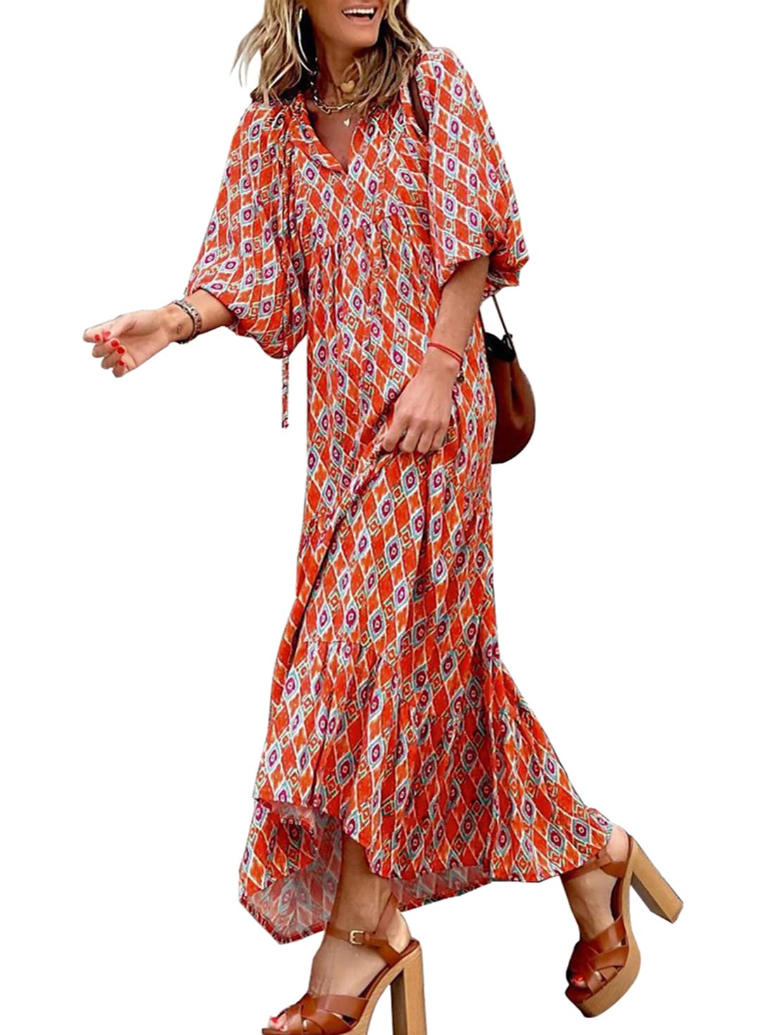 Red floral boho maxi dress by THE WHITMORE FAMILY, featuring a flowing silhouette and vibrant floral pattern.