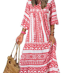 Nina floral boho maxi dress by THE WHITMORE FAMILY featuring vibrant red and colorful floral patterns, flowing fabric, and relaxed fit.