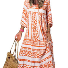 Nina floral boho maxi dress by THE WHITMORE FAMILY featuring vibrant red and colorful floral patterns, flowing fabric, and bohemian style.