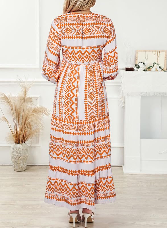 Nina floral boho maxi dress by THE WHITMORE FAMILY, featuring a vibrant red and floral pattern, flowing fabric, and bohemian style.
