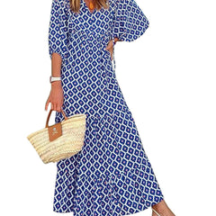 Nina floral boho maxi dress by THE WHITMORE FAMILY featuring a vibrant red floral pattern and flowing silhouette.