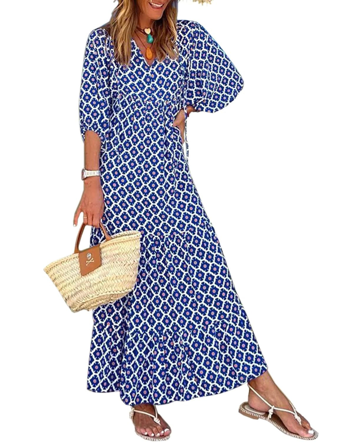 Nina floral boho maxi dress by THE WHITMORE FAMILY featuring a vibrant red floral pattern and flowing silhouette.