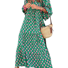 Nina floral boho maxi dress by THE WHITMORE FAMILY, featuring a colorful floral pattern and flowing silhouette.