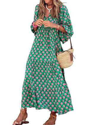 Nina floral boho maxi dress by THE WHITMORE FAMILY, featuring a colorful floral pattern and flowing silhouette.