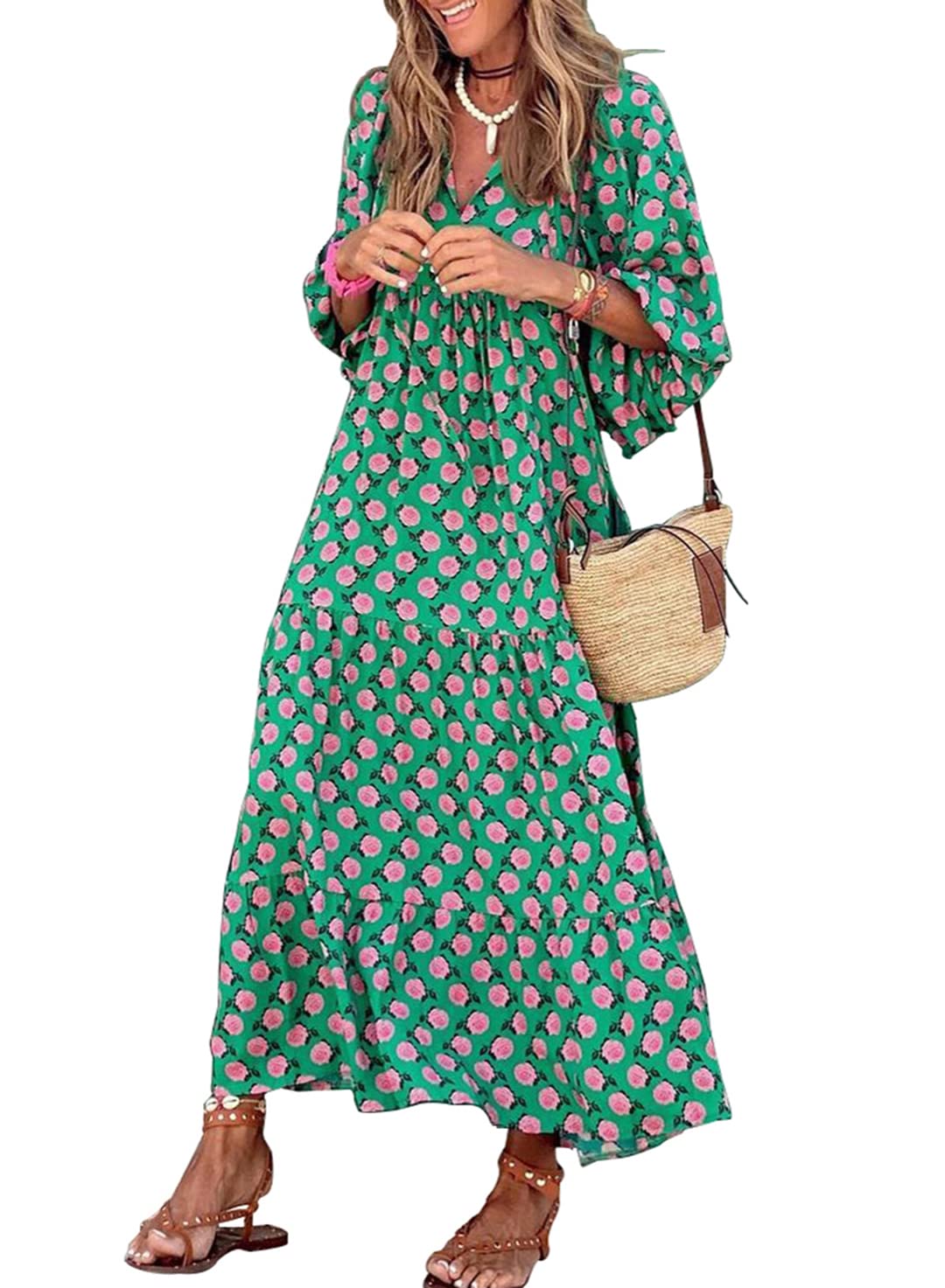 Nina floral boho maxi dress by THE WHITMORE FAMILY, featuring a colorful floral pattern and flowing silhouette.