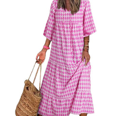 Nina floral boho maxi dress by THE WHITMORE FAMILY, featuring a vibrant red floral pattern and flowing silhouette.