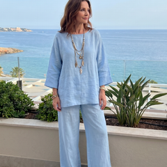 THE WHITMORE FAMILY Prue oversized tunic and wide-leg pant set in vibrant red, styled for a casual, relaxed look.
