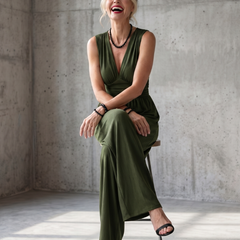Vincenza deep V waist jumpsuit by THE WHITMORE FAMILY featuring wide-leg design and bold red color.