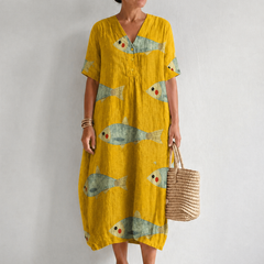 Artistically inspired cotton dress by THE WHITMORE FAMILY featuring a flowing design and vibrant pattern.