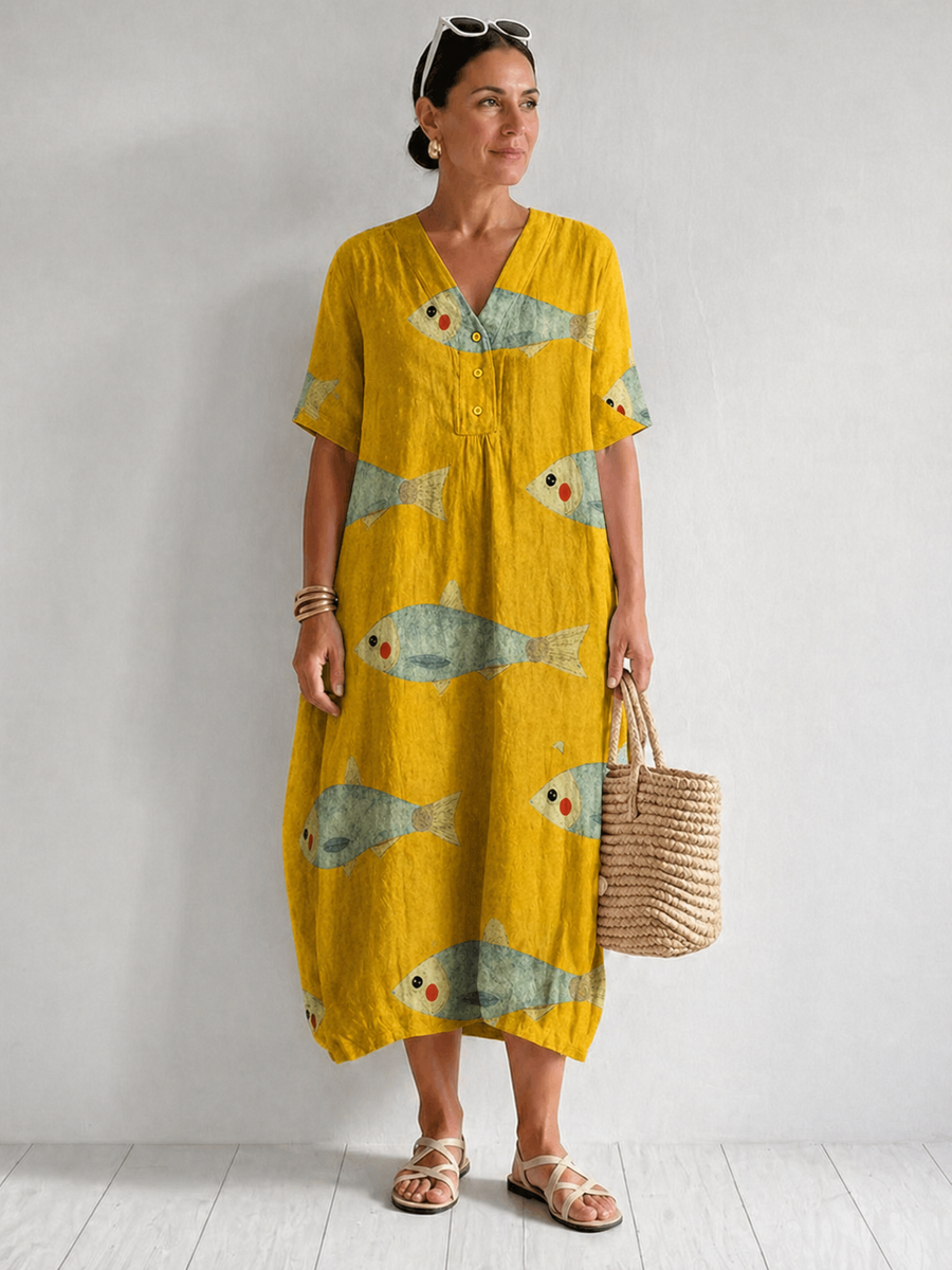 Artistically inspired cotton dress by THE WHITMORE FAMILY featuring a flowing design and vibrant pattern.
