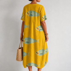 Artistically inspired cotton dress by THE WHITMORE FAMILY, featuring a flowing design and vibrant pattern.