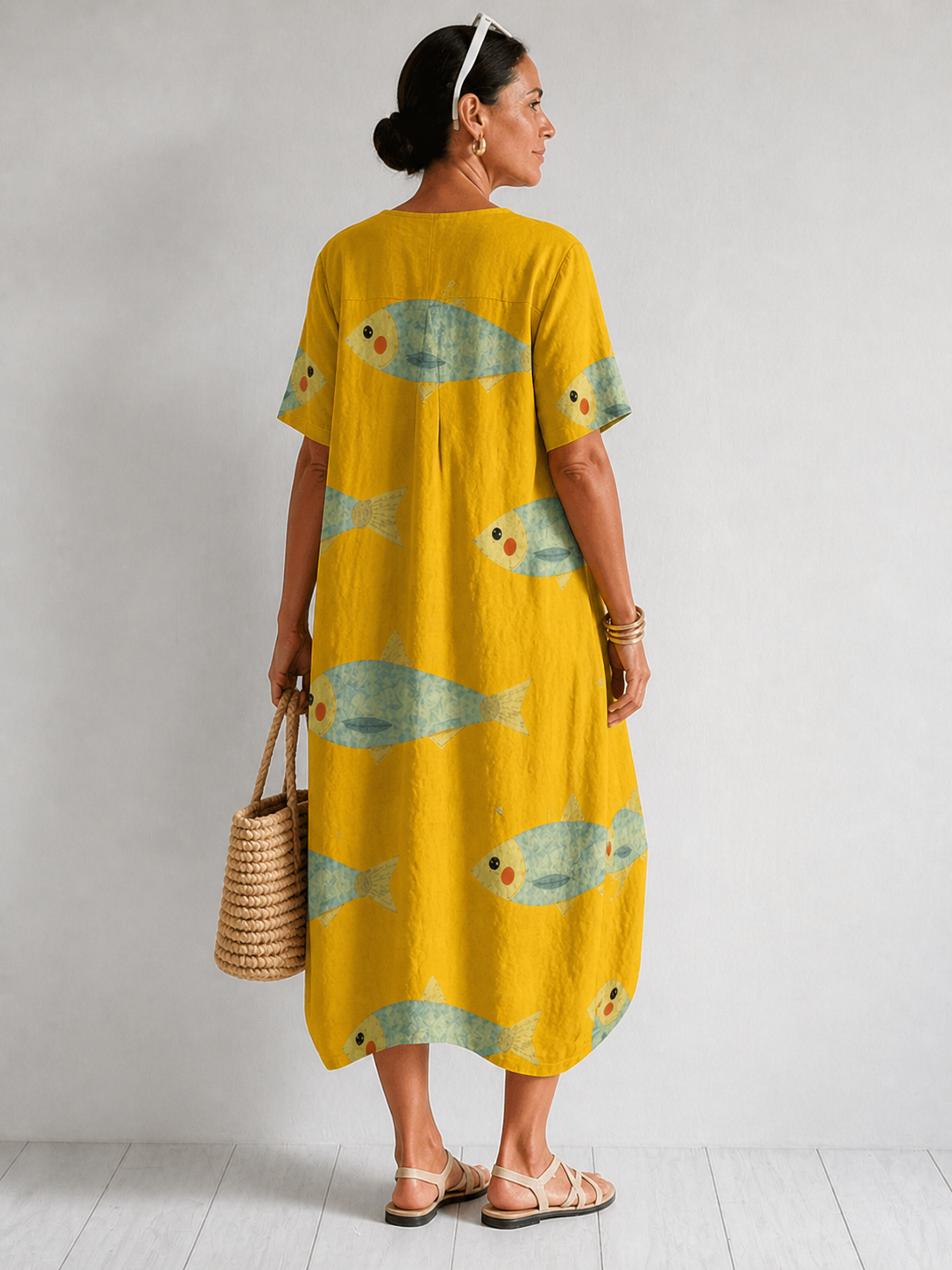 Artistically inspired cotton dress by THE WHITMORE FAMILY, featuring a flowing design and vibrant pattern.