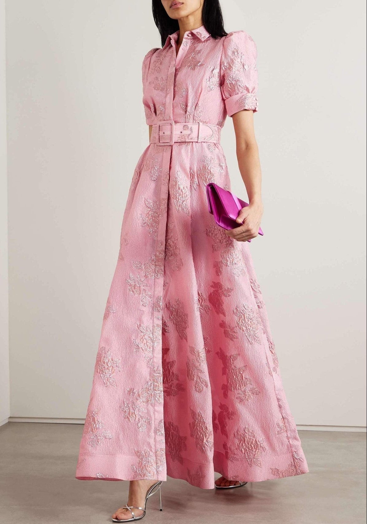 Anabella dress by THE WHITMORE FAMILY featuring short puff sleeves, displayed on a hanger with a soft, neutral background.