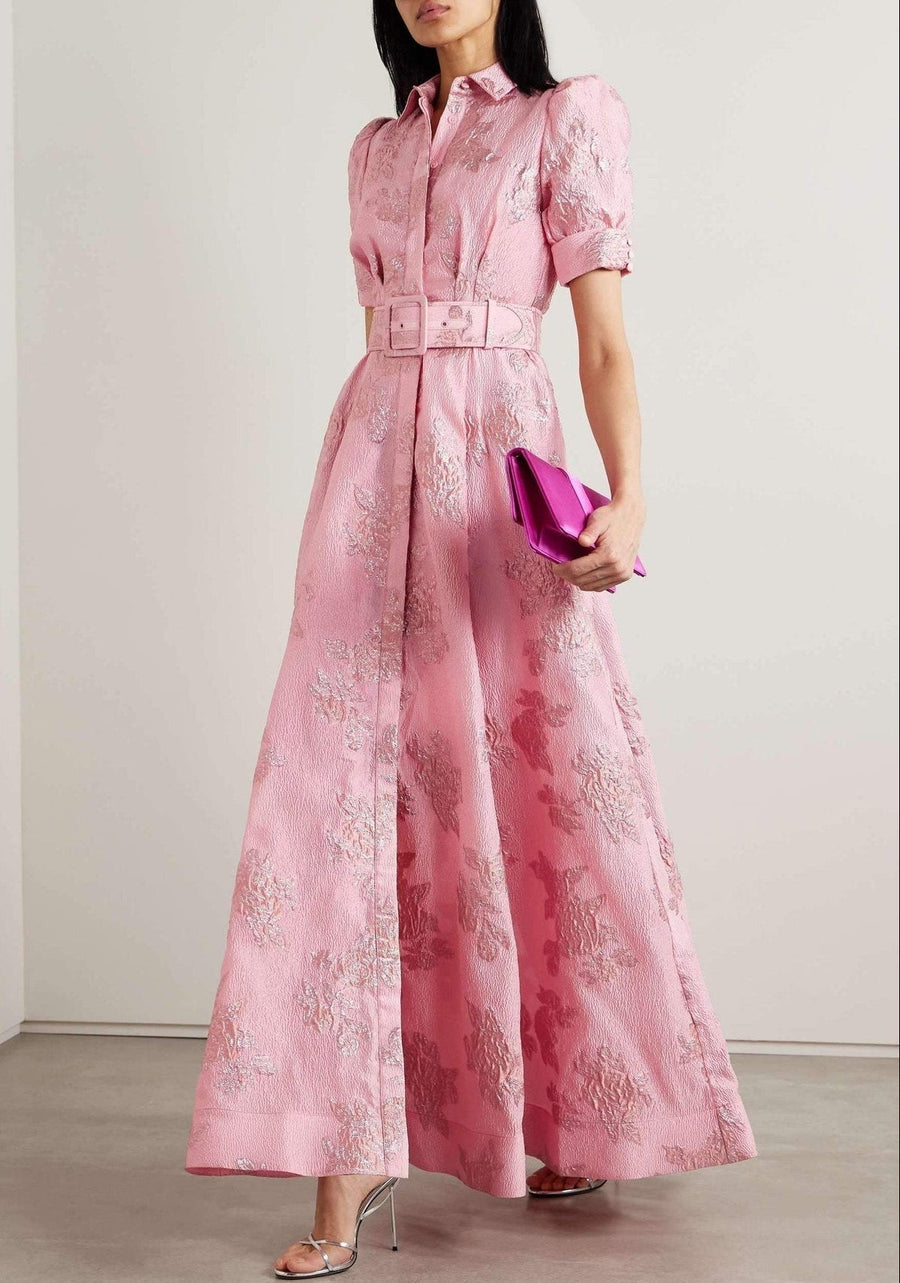 Anabella dress by THE WHITMORE FAMILY featuring short puff sleeves, displayed on a hanger with a soft, neutral background.