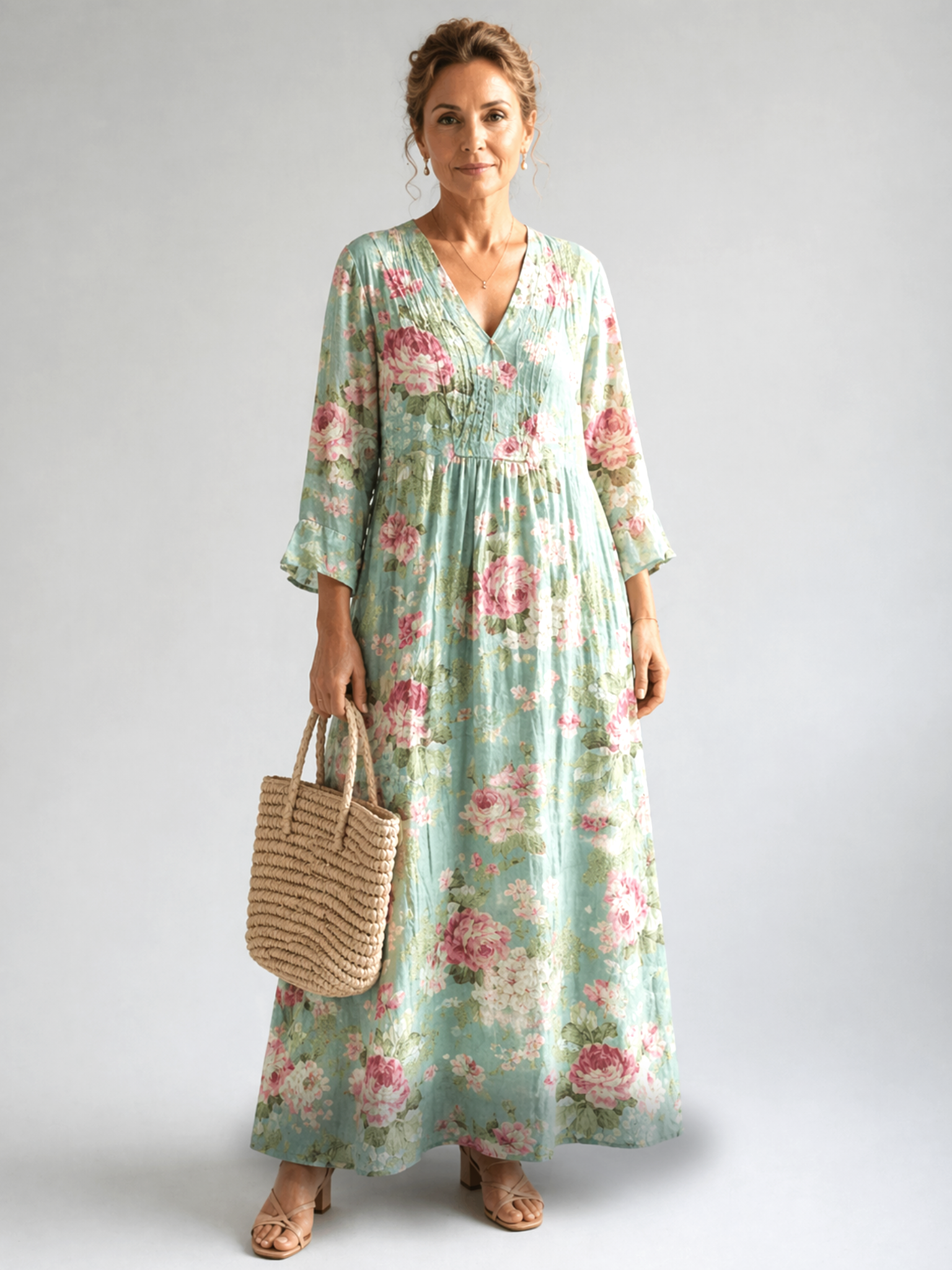 Anne printed summer dress by THE WHITMORE FAMILY, featuring a flowy fabric with colorful floral patterns and a sleeveless design.