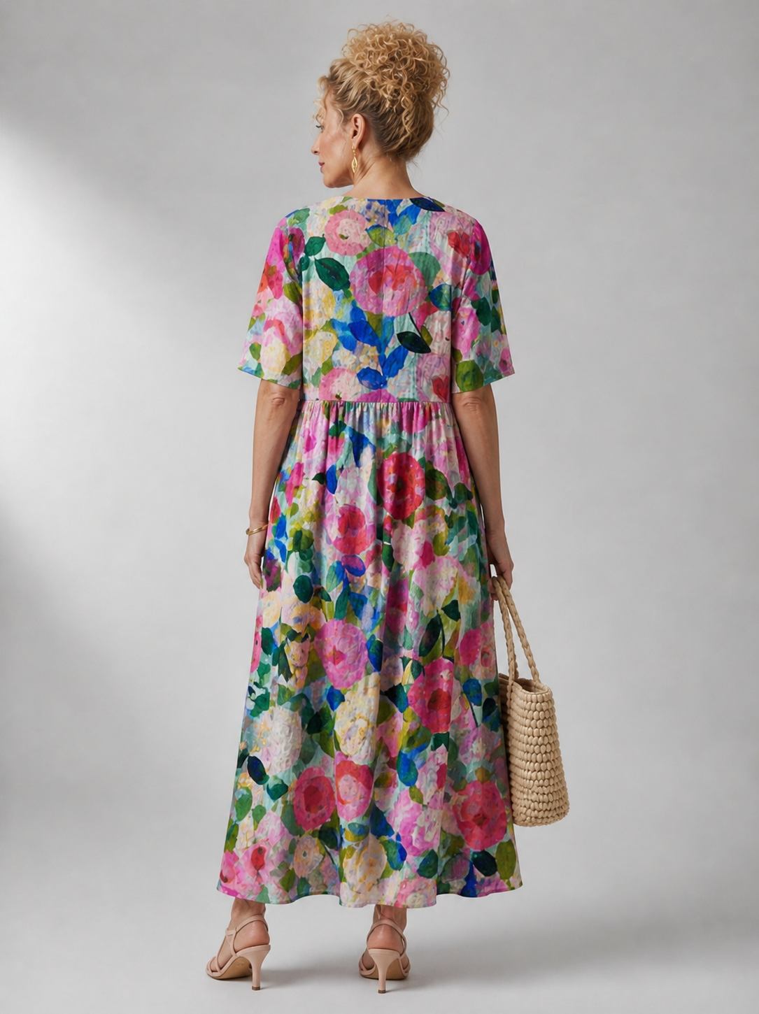 Bente vintage flower dress by THE WHITMORE FAMILY displayed on a hanger, showcasing floral pattern and classic style.