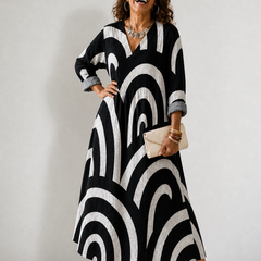 Cynthia Summer Breeze printed dress by THE WHITMORE FAMILY featuring lightweight fabric and a floral pattern.