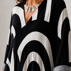 Cynthia Summer Breeze printed dress by THE WHITMORE FAMILY, featuring lightweight fabric and a colorful floral pattern.